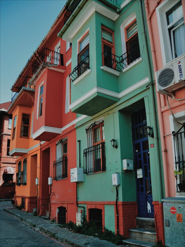 Brightly painted houses line the historic streets of Balat, Istanbul, showcasing vibrant architecture.