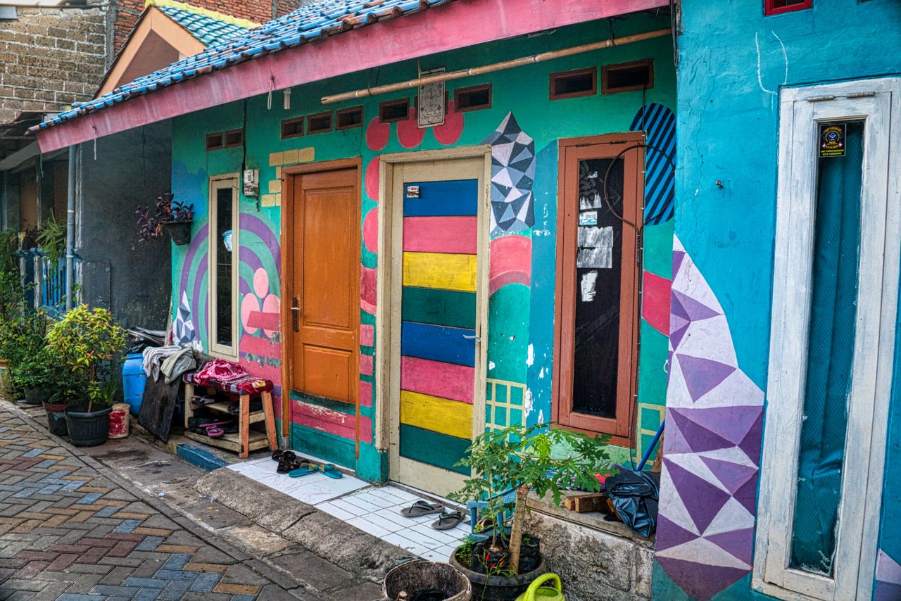 Vibrant street scene featuring a colorful house facade in Banten, Indonesia.